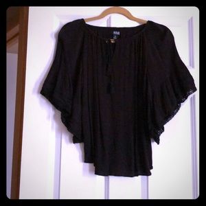 Black top. Can be worn off the shoulders.